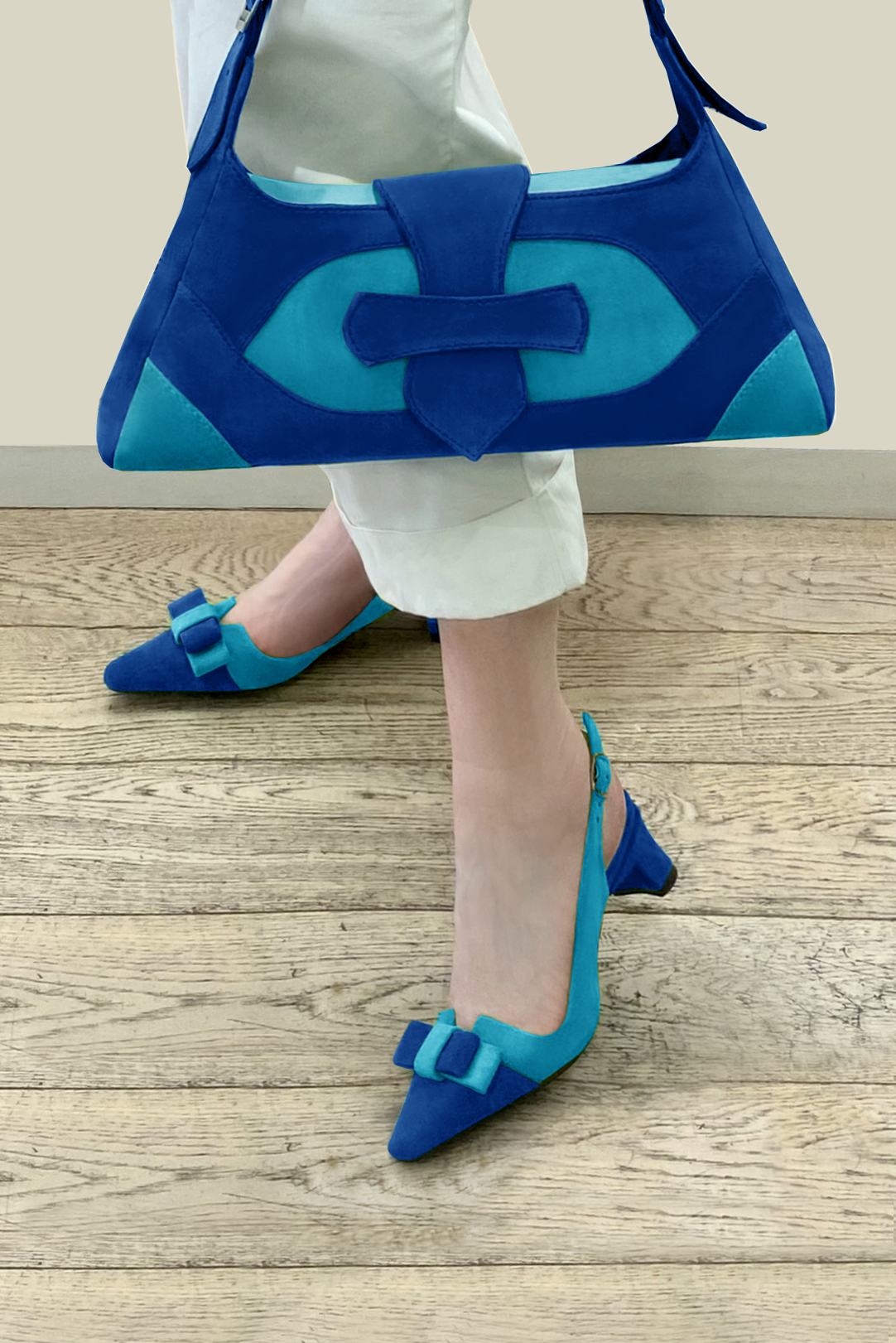 Electric blue women's dress handbag, matching pumps and belts. Worn view - Florence KOOIJMAN